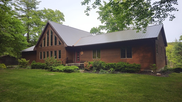 4300 Holton-Duck Lake Rd, Twin Lake, MI 49457 - rear view of property with a lawn and metal roof