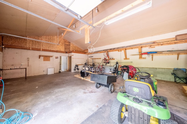 4300 Holton-Duck Lake Rd, Twin Lake, MI 49457 - garage featuring a workshop area
