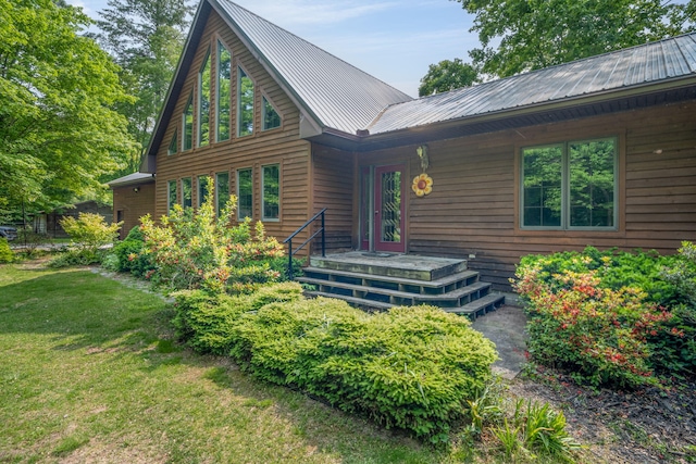 4300 Holton-Duck Lake Rd, Twin Lake, MI 49457 - chalet / cabin with a front lawn and metal roof