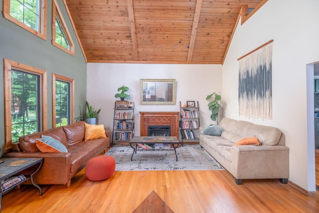 4300 Holton-Duck Lake Rd, Twin Lake, MI 49457 - living area with high vaulted ceiling, wooden ceiling with exposed beams, wood finished floors, and a fireplace
