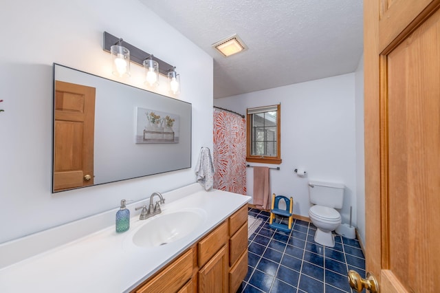 4300 Holton-Duck Lake Rd, Twin Lake, MI 49457 - full bathroom featuring toilet, vanity, tile patterned floors, and a textured ceiling