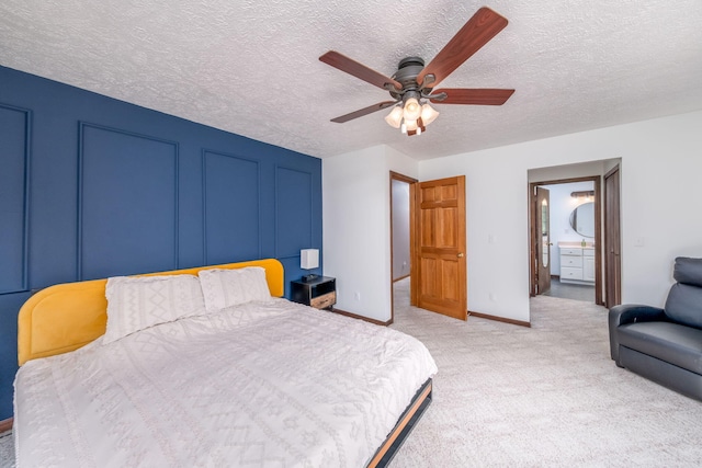 4300 Holton-Duck Lake Rd, Twin Lake, MI 49457 - bedroom with a textured ceiling, light colored carpet, baseboards, ensuite bathroom, and ceiling fan