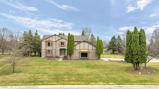 4070 Greenbriar Ct, Rochester, MI 48306 - english style home featuring stone siding, a front lawn, and stucco siding