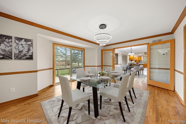4070 Greenbriar Ct, Rochester, MI 48306 - dining space with crown molding, baseboards, and light wood-type flooring
