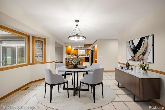 4070 Greenbriar Ct, Rochester, MI 48306 - dining space with light tile patterned flooring, baseboards, and a chandelier
