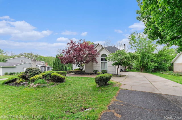 2337 Horseshoe Dr, West Bloomfield, MI 48322 - obstructed view of property with a front yard