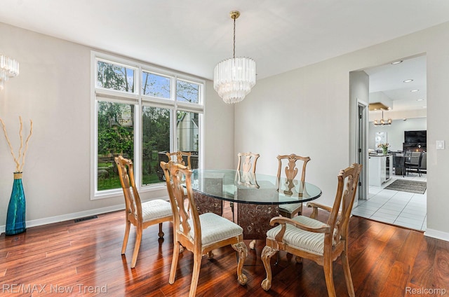 2337 Horseshoe Dr, West Bloomfield, MI 48322 - dining area with a chandelier, wood finished floors, baseboards, and recessed lighting