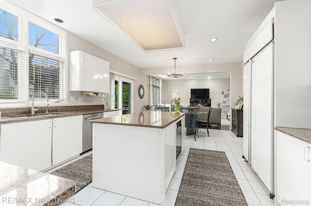2337 Horseshoe Dr, West Bloomfield, MI 48322 - kitchen with a sink, dishwasher, a center island, dark stone countertops, and white cabinets