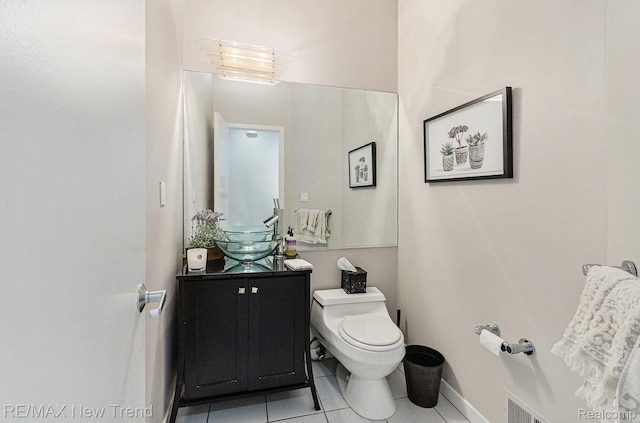 2337 Horseshoe Dr, West Bloomfield, MI 48322 - bathroom featuring toilet, vanity, tile patterned flooring, and baseboards