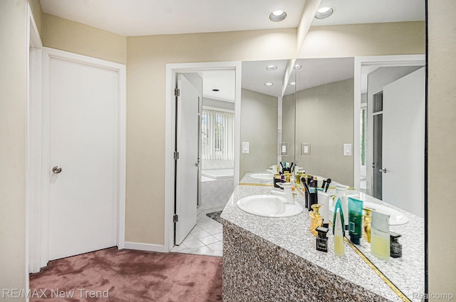 2337 Horseshoe Dr, West Bloomfield, MI 48322 - bathroom featuring double vanity, a bath, and baseboards