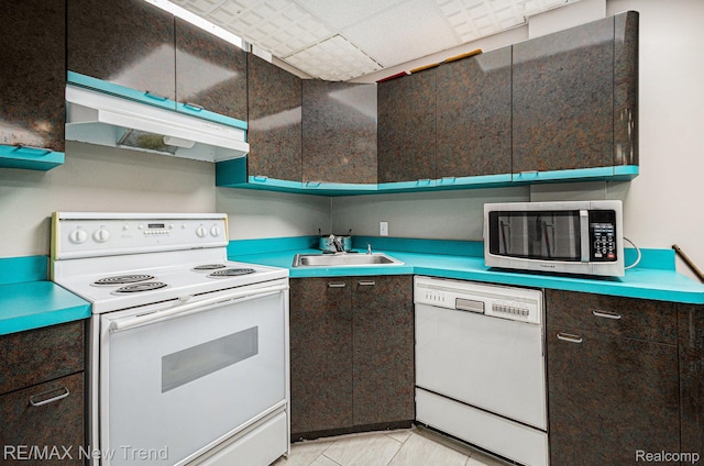 2337 Horseshoe Dr, West Bloomfield, MI 48322 - kitchen featuring white appliances, a sink, under cabinet range hood, dark brown cabinetry, and light tile patterned flooring