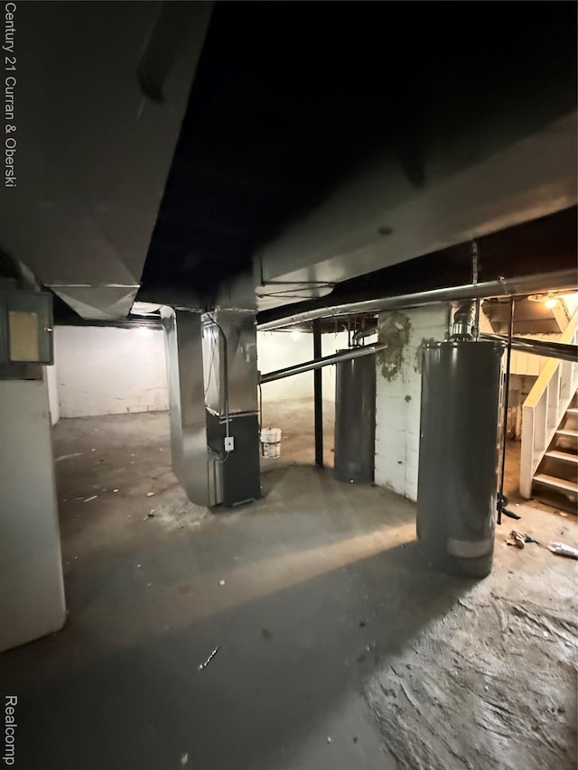 11647 Cascade St, Detroit, MI 48204 - unfinished below grade area featuring stairs, heating unit, and gas water heater