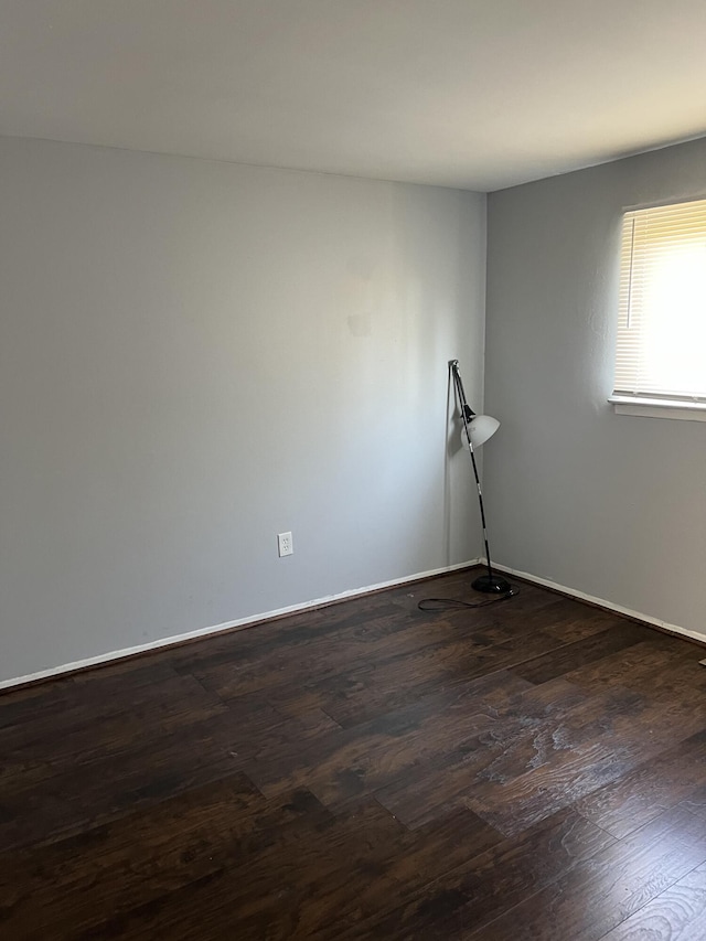 13990 Lauder St, Detroit, MI 48227 - unfurnished room featuring dark wood-style flooring and baseboards