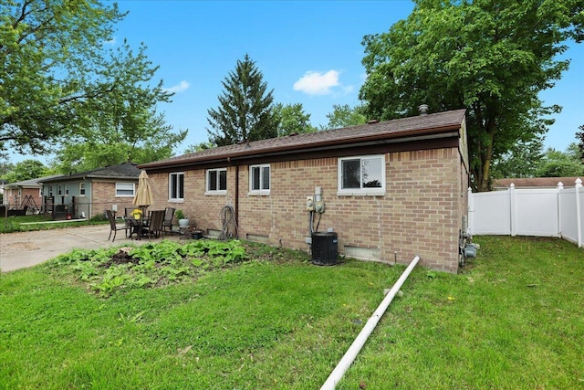 9939 Hamilton St, Michigan, MI 48111 - view of property exterior featuring a patio and brick siding