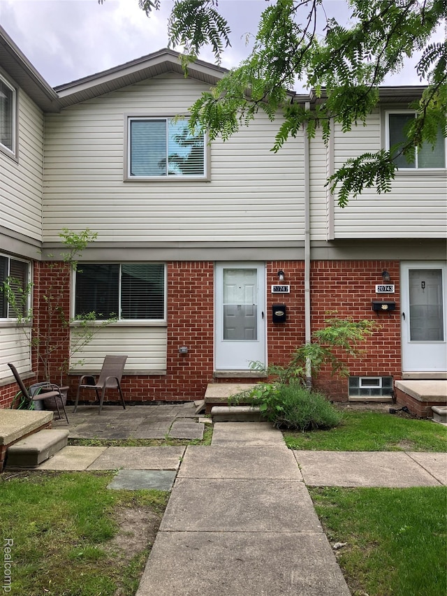 20747 Washington Dr, Roseville, MI 48066 - view of front facade with brick siding and a patio