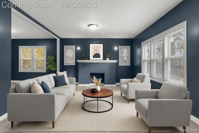 16509 Woodingham Dr, Detroit, MI 48221 - living room featuring baseboards, a brick fireplace, and wood finished floors