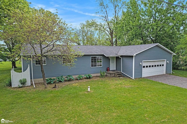 10207 Frances Rd, Flushing, MI 48433 - ranch-style house featuring a front yard, an attached garage, a shingled roof, and driveway