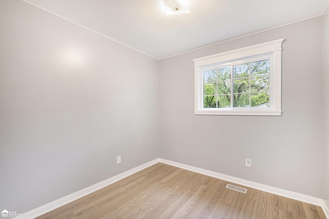 10207 Frances Rd, Flushing, MI 48433 - spare room with baseboards and light wood-style flooring