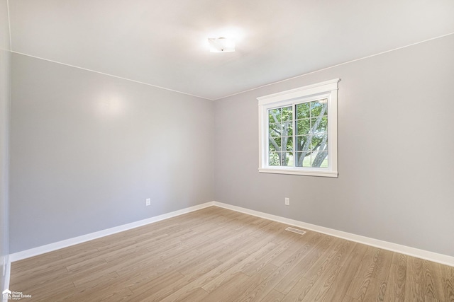 10207 Frances Rd, Flushing, MI 48433 - spare room with baseboards and light wood-style flooring
