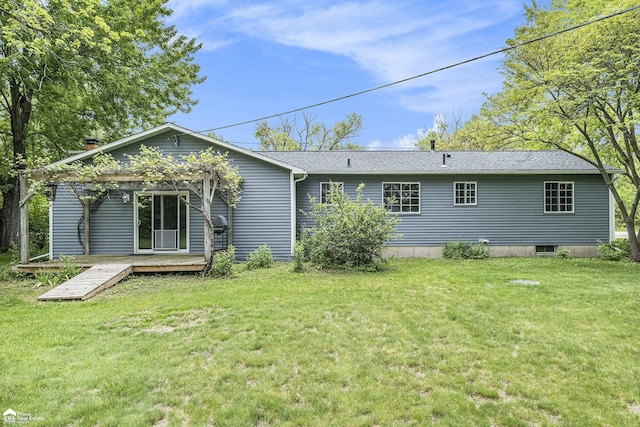 10207 Frances Rd, Flushing, MI 48433 - rear view of house with a yard, a wooden deck, and a shingled roof