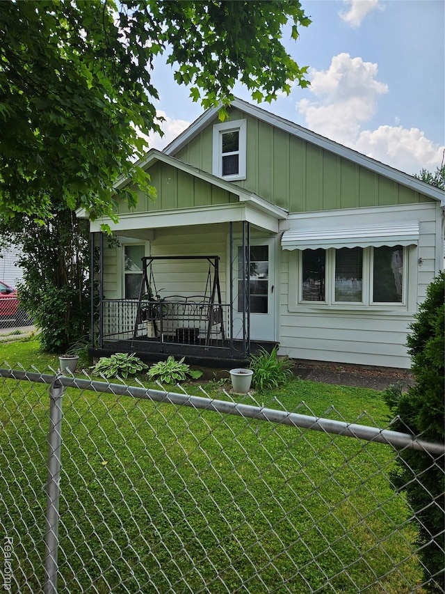 2138 E Judd Rd, Burton, MI 48529 - bungalow-style house with board and batten siding and covered porch