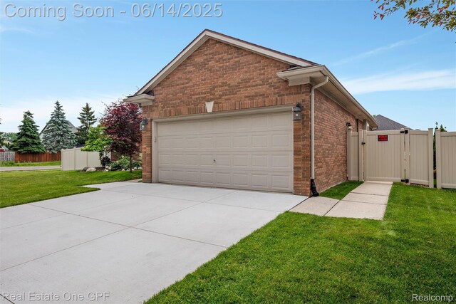52657 Creekside Dr, Chesterfield, MI 48047 - view of property exterior with brick siding, a gate, and concrete driveway