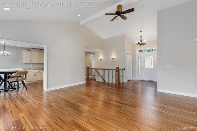 52657 Creekside Dr, Chesterfield, MI 48047 - unfurnished living room with a chandelier, beamed ceiling, high vaulted ceiling, ceiling fan, and light wood finished floors