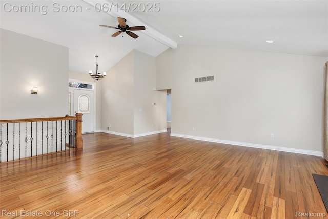52657 Creekside Dr, Chesterfield, MI 48047 - empty room with a ceiling fan, beamed ceiling, wood finished floors, a chandelier, and high vaulted ceiling