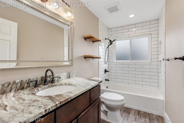 52657 Creekside Dr, Chesterfield, MI 48047 - bathroom featuring vanity, tub / shower combination, wood finished floors, and recessed lighting