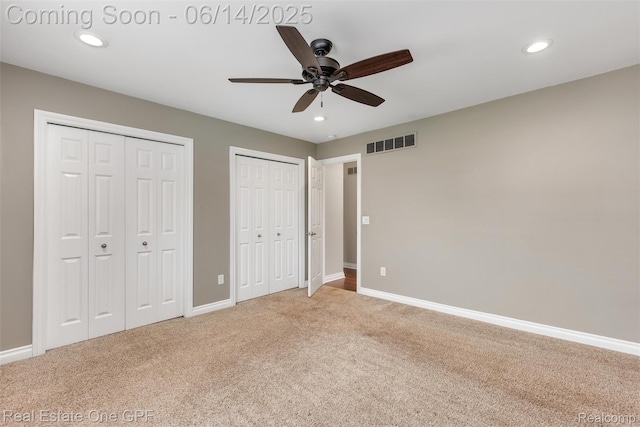 52657 Creekside Dr, Chesterfield, MI 48047 - unfurnished bedroom with multiple closets, light colored carpet, recessed lighting, and a ceiling fan