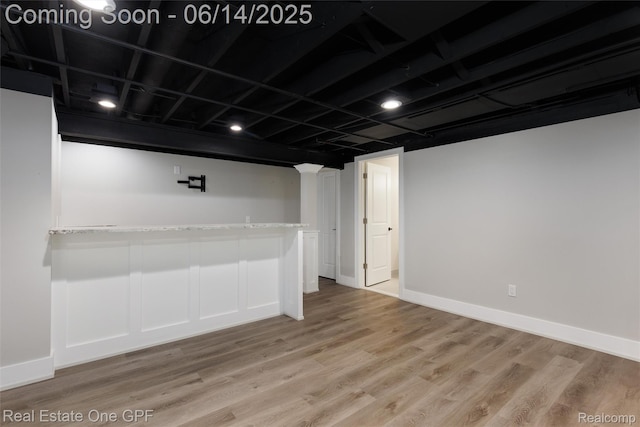 52657 Creekside Dr, Chesterfield, MI 48047 - finished basement with light wood-style flooring and baseboards
