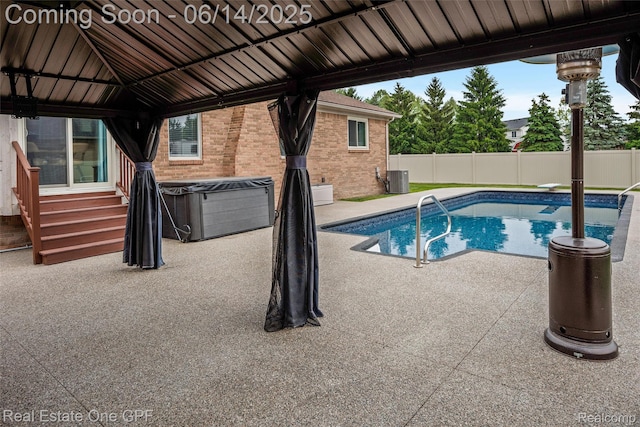 52657 Creekside Dr, Chesterfield, MI 48047 - view of pool featuring a hot tub, a gazebo, entry steps, a fenced backyard, and a patio