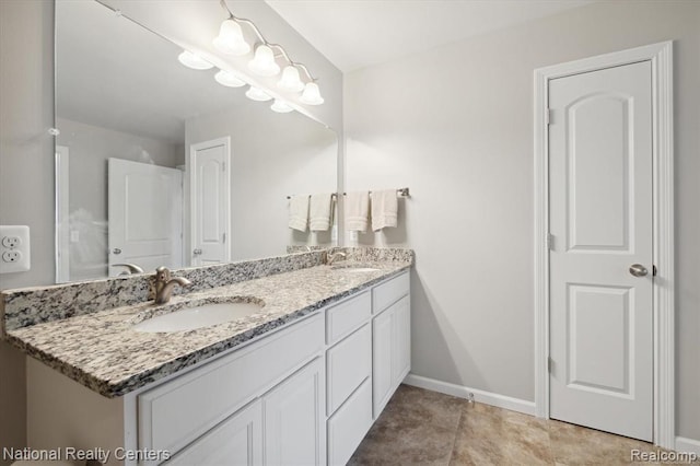 251 Devonshire Dr Unit 1, Lapeer, MI 48446 - full bath with double vanity and baseboards