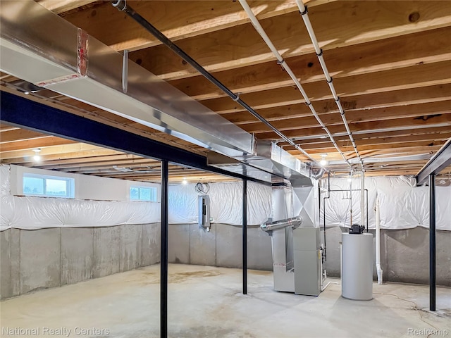 251 Devonshire Dr Unit 1, Lapeer, MI 48446 - below grade area featuring heating unit, water heater, and electric panel