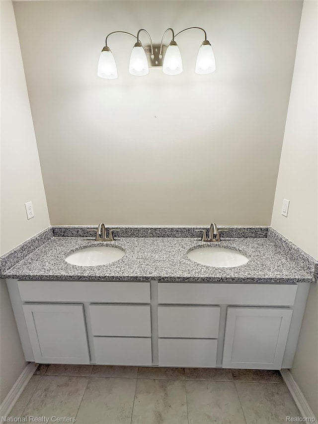 251 Devonshire Dr Unit 1, Lapeer, MI 48446 - bathroom featuring double vanity and tile patterned flooring