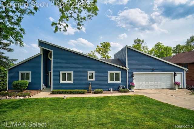 7457 Haviland Beach Dr, Argentine, MI 48451 - mid-century inspired home with concrete driveway, a front yard, and a garage