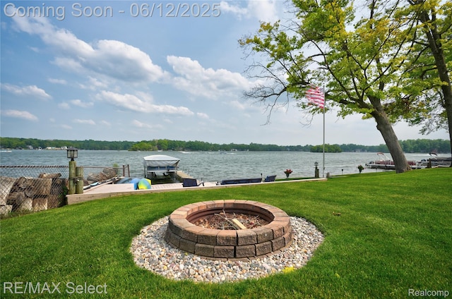 7457 Haviland Beach Dr, Argentine, MI 48451 - view of green lawn with a boat dock, a water view, a fire pit, and boat lift