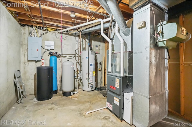 7457 Haviland Beach Dr, Argentine, MI 48451 - utility room featuring electric panel and gas water heater