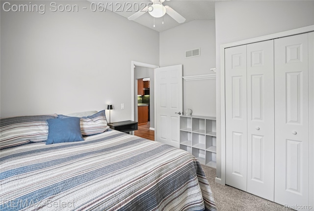 7457 Haviland Beach Dr, Argentine, MI 48451 - carpeted bedroom with high vaulted ceiling, a closet, ceiling fan, and baseboards