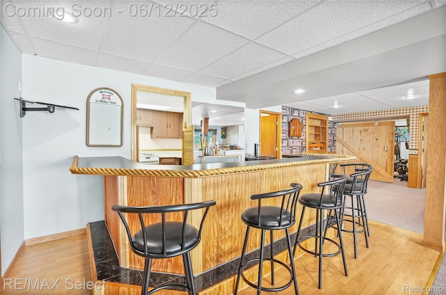 7457 Haviland Beach Dr, Argentine, MI 48451 - indoor bar with baseboards, light wood finished floors, a drop ceiling, and range