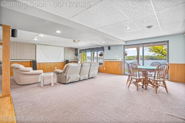 7457 Haviland Beach Dr, Argentine, MI 48451 - living area with wainscoting, wood walls, a paneled ceiling, and carpet floors