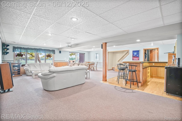 7457 Haviland Beach Dr, Argentine, MI 48451 - living room with a paneled ceiling, bar area, light colored carpet, and recessed lighting