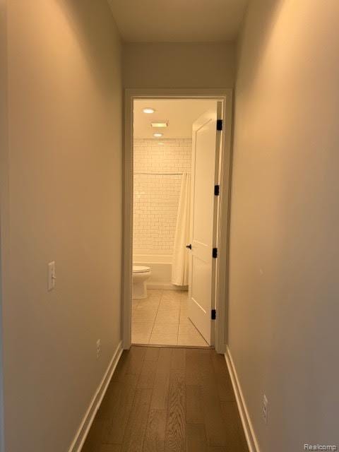 804 N Main St Unit 2A, Rochester, MI 48307 - hall featuring baseboards and dark wood finished floors