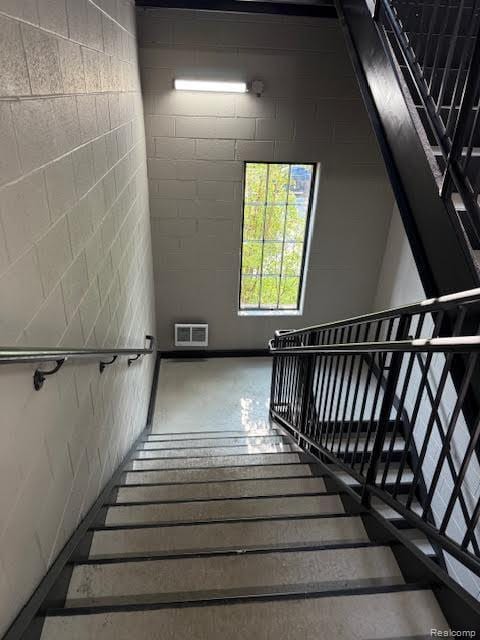 804 N Main St Unit 2A, Rochester, MI 48307 - stairs featuring wood finished floors