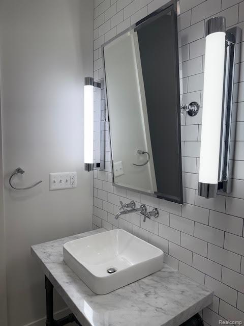 804 N Main St Unit 2A, Rochester, MI 48307 - bathroom with tasteful backsplash and vanity