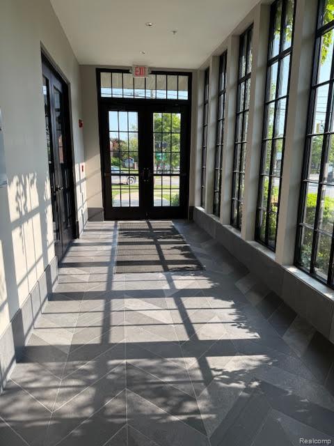 804 N Main St Unit 2A, Rochester, MI 48307 - unfurnished sunroom featuring french doors