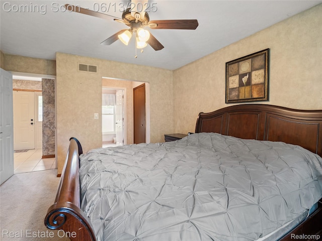 8907 Mccoll Side Rd, Brighton, MI 48116 - bedroom with light colored carpet and ceiling fan