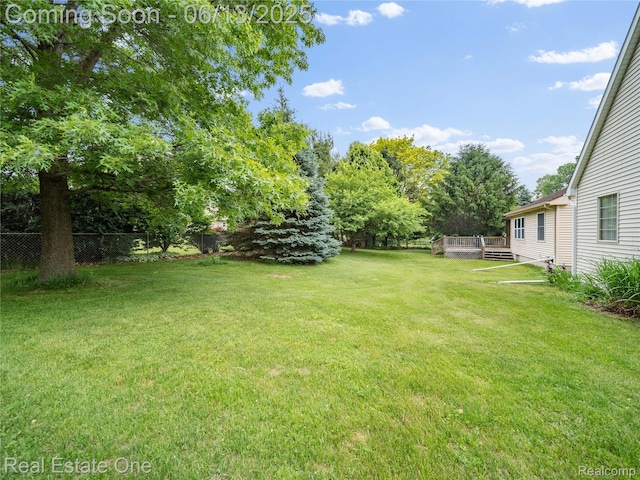 8907 Mccoll Side Rd, Brighton, MI 48116 - view of yard featuring a deck
