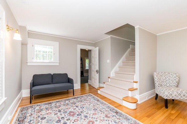 2430 Geddes Ave, Ann Arbor, MI 48104 - sitting room with crown molding, wood finished floors, stairway, and baseboards