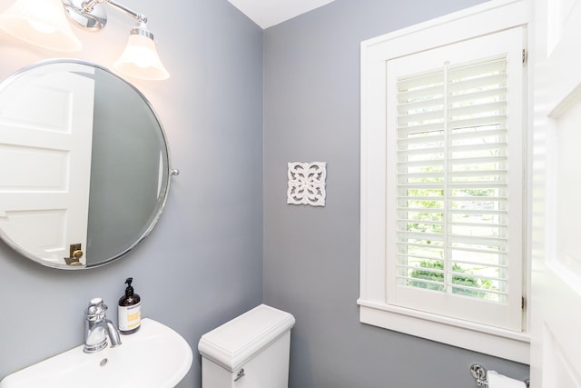 2430 Geddes Ave, Ann Arbor, MI 48104 - half bathroom featuring a sink and toilet